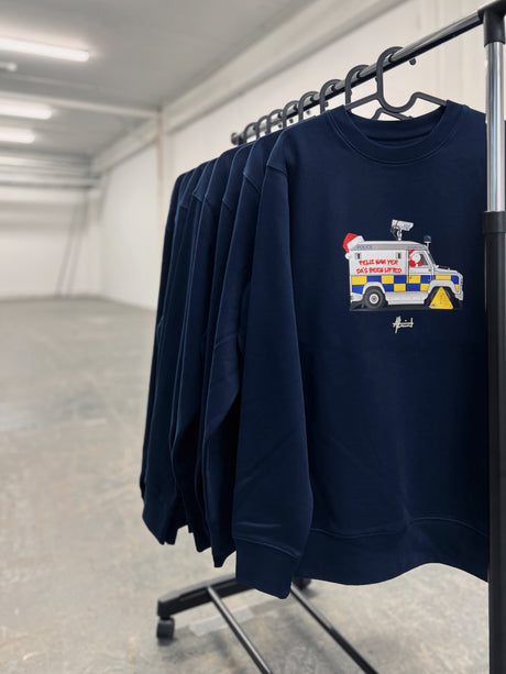 Rail of navy Feliz Navi Yer Da 2026 Christmas jumpers by AJ Laird